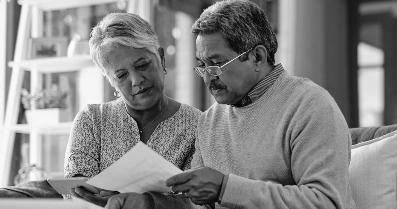 Two people looking at their financial plan