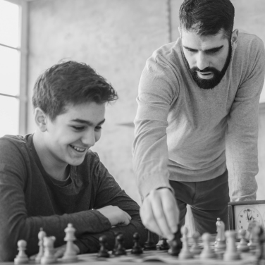 A group of friends playing chess